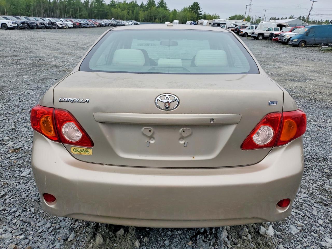 2010 Toyota Corolla Base Золотой vin: 2T1BU4EE3AC193552