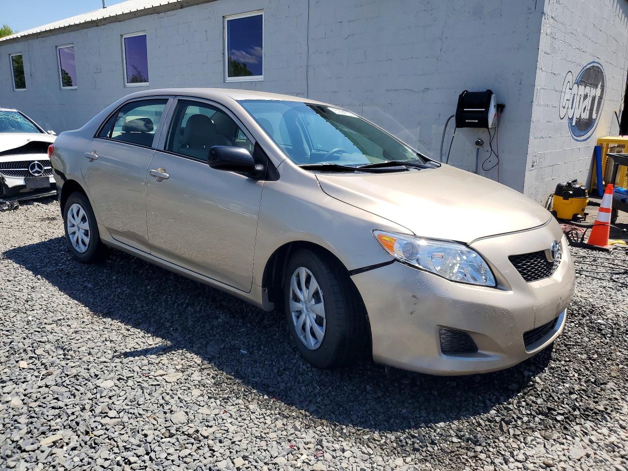 2010 Toyota Corolla Base Tan vin: 2T1BU4EE7AC231087
