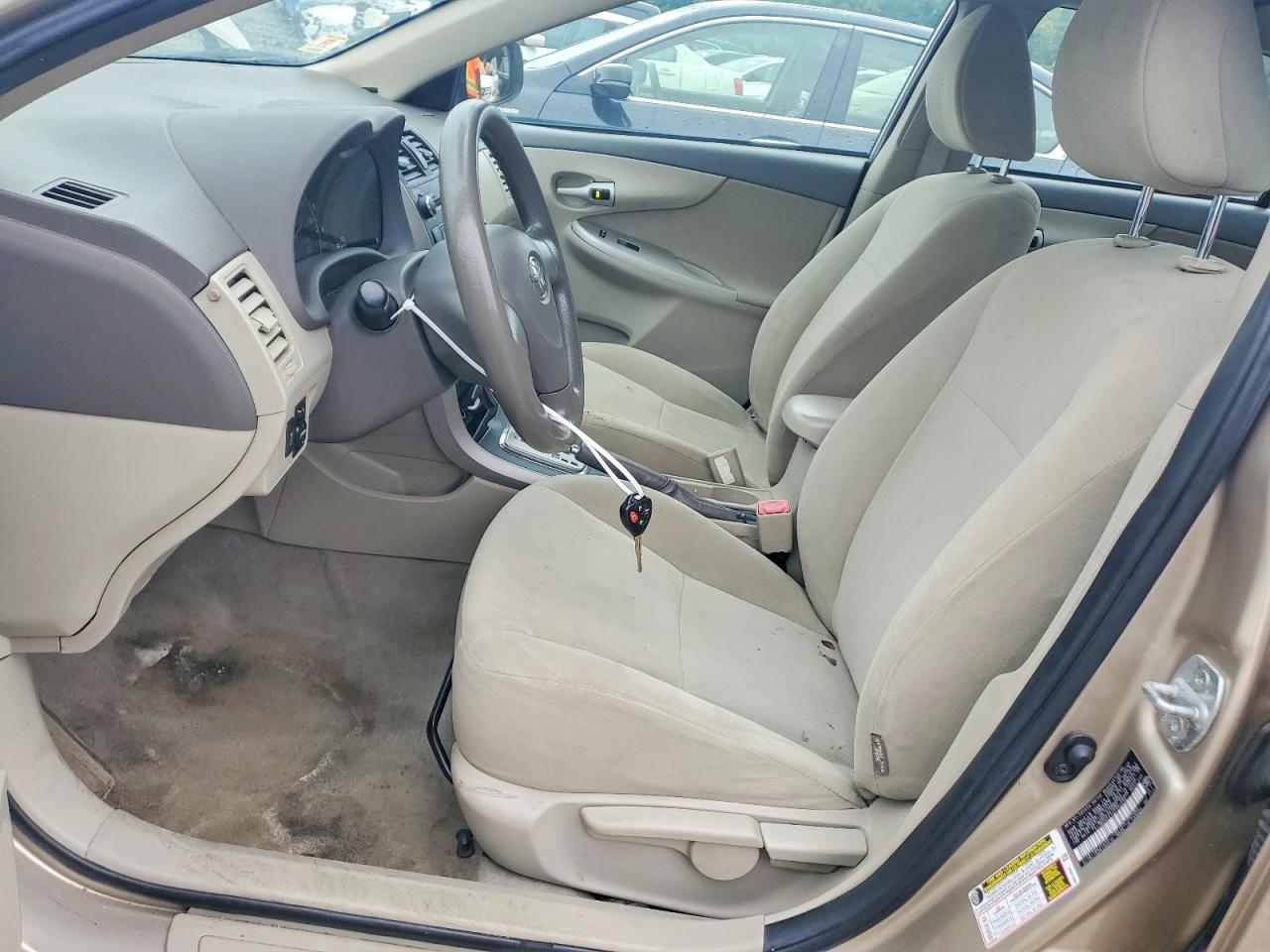 2010 Toyota Corolla Le Tan vin: 2T1BU4EE7AC323235