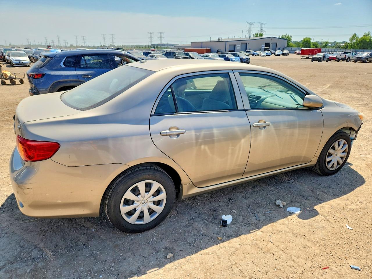 2010 Toyota Corolla Le Gold vin: 2T1BU4EEXAC292370