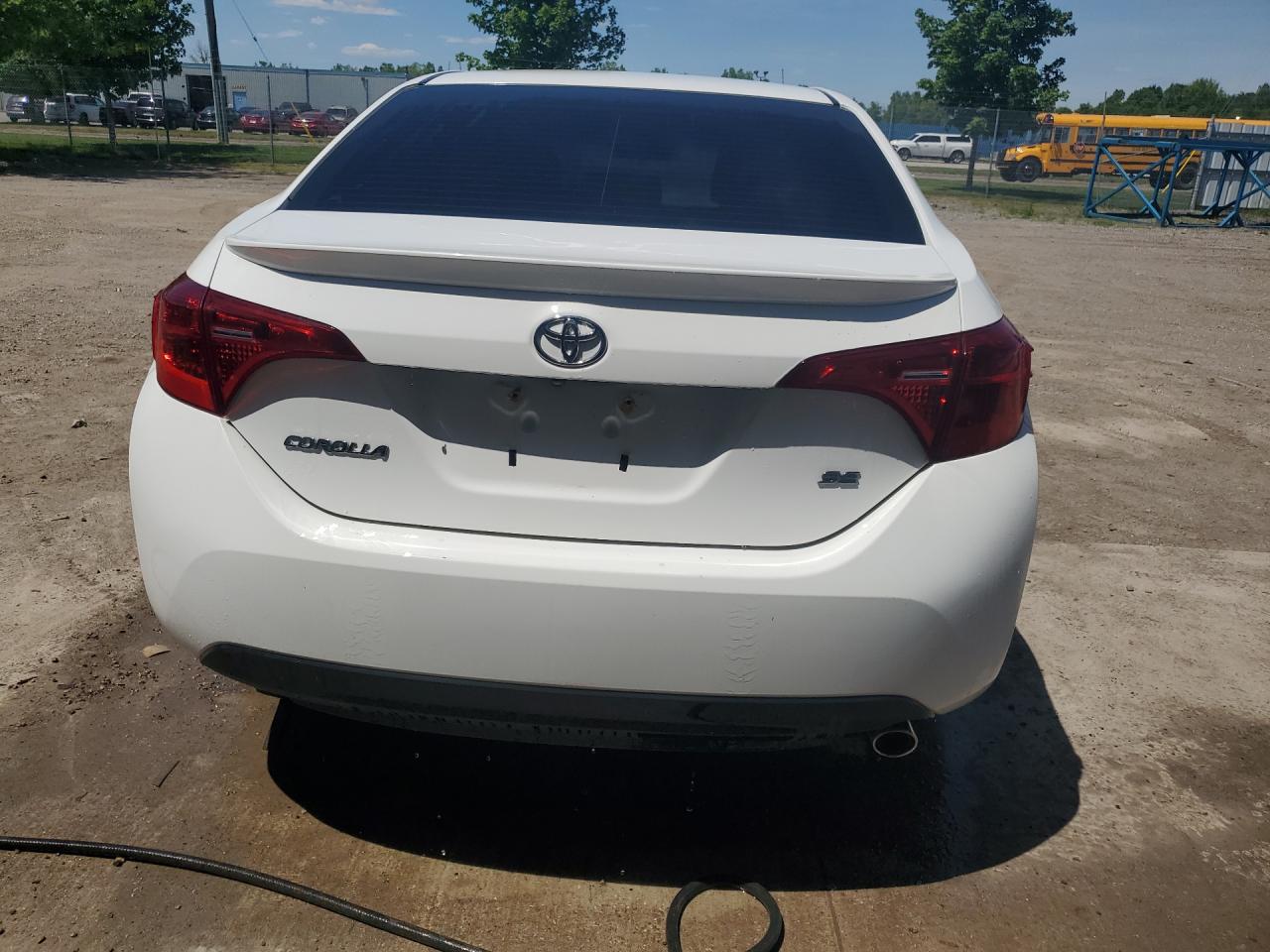 2018 Toyota Corolla L White vin: 2T1BURHE6JC031004 Damage: Rear Bumper/Cover, Scraped, 1/2 To 1 Inch