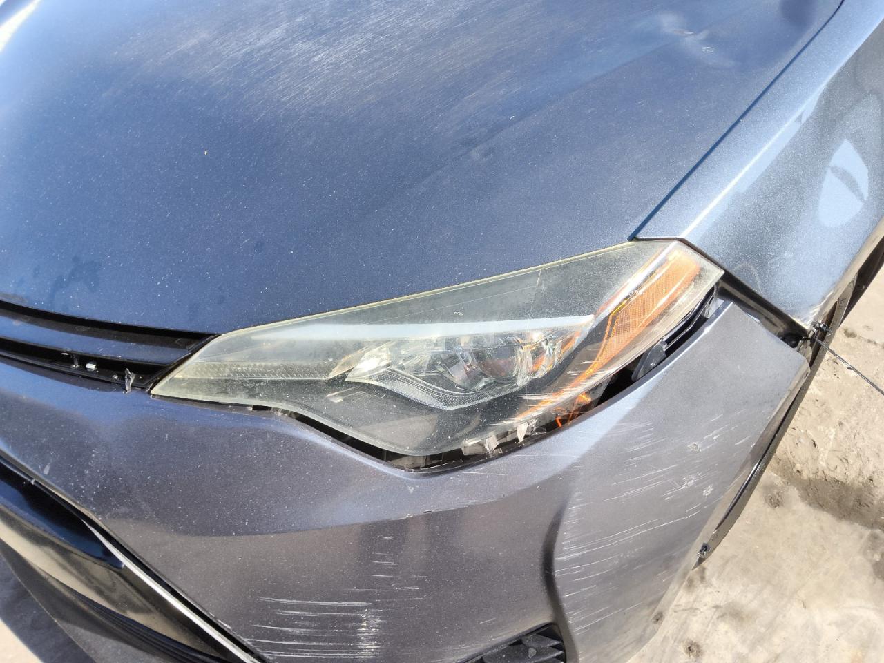 2018 Toyota Corolla Le Blue vin: 2T1BURHE6JC065721 Damage: Left Head Lamp, Faded, Repair Required