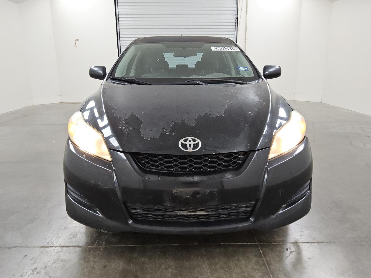 2009 Toyota Matrix Base Black vin: 2T1KU40E49C088294 Damage: Left Head Lamp, Faded, Acceptable