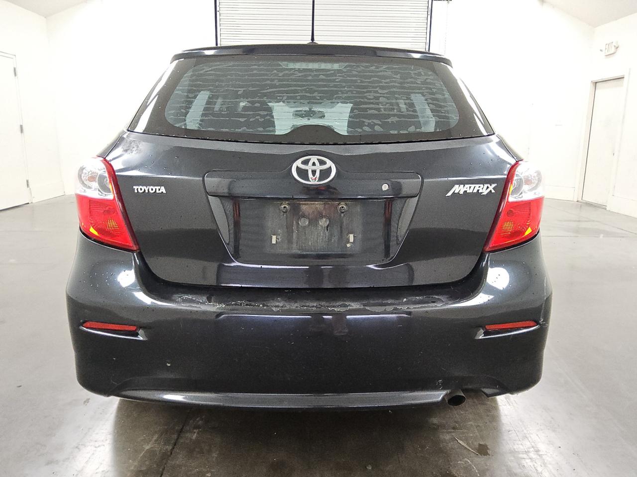 2009 Toyota Matrix Base Black vin: 2T1KU40E49C088294 Damage: Lift Gate, Peeling, > 12 Inches