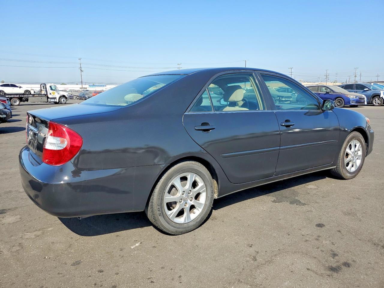 2004 Toyota Camry Le Black vin: JTDBE30K140279025