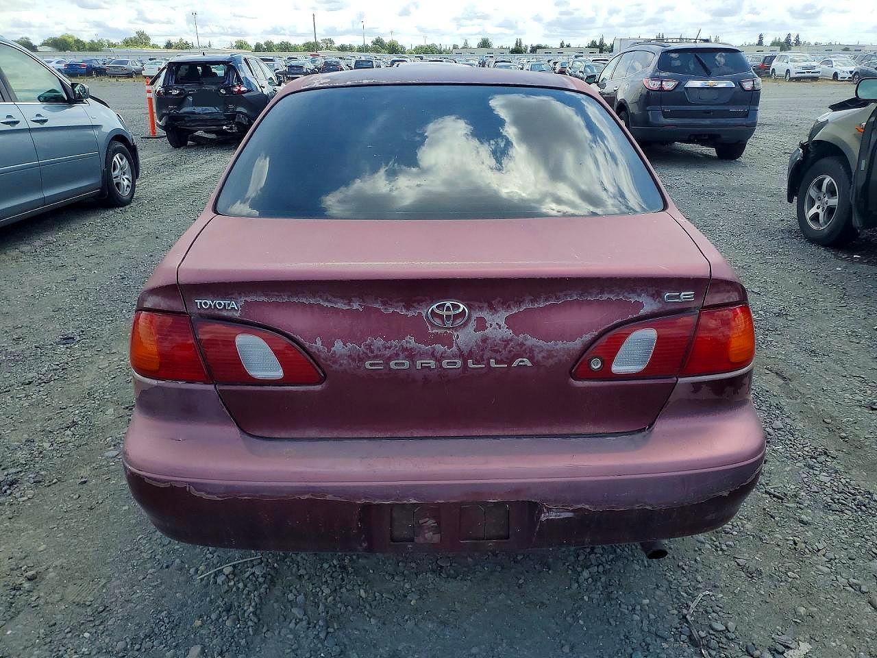1998 Toyt Corolla Burgundy vin: 1NXBR12E5WZ021632