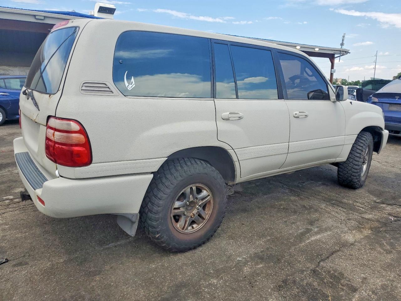 2000 Toyota Land Cruiser Base Beige vin: JT3HT05J2Y0096774