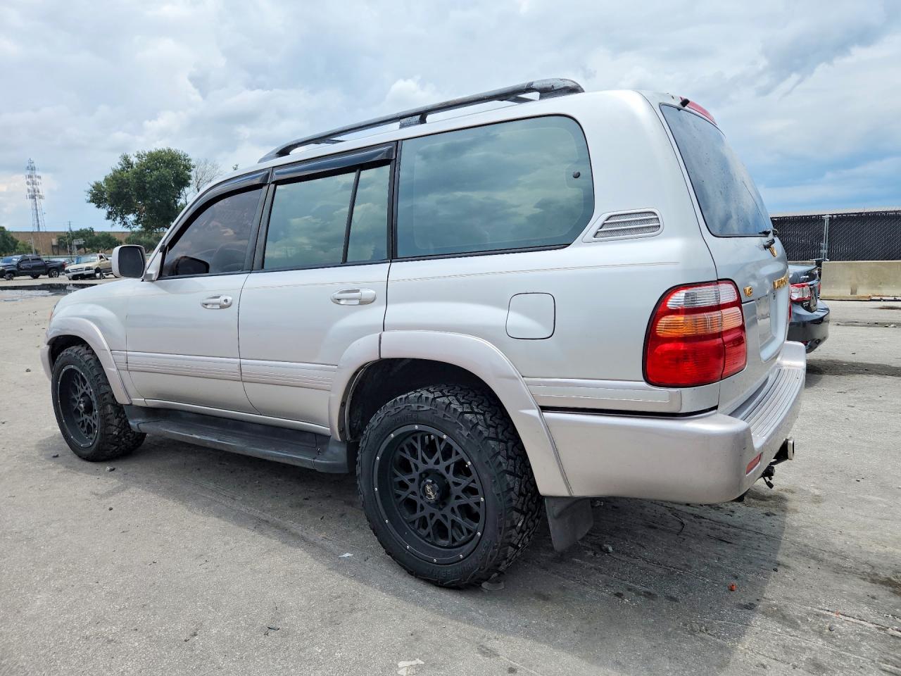 1999 Toyota Land Cruiser Base Gold vin: JT3HT05J5X0027141