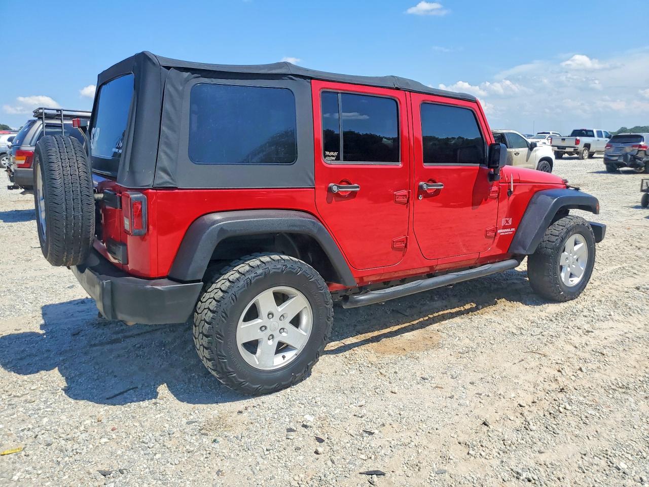 2009 Jeep Wrangler Unlimited X Red vin: 1J4GA39149L767302