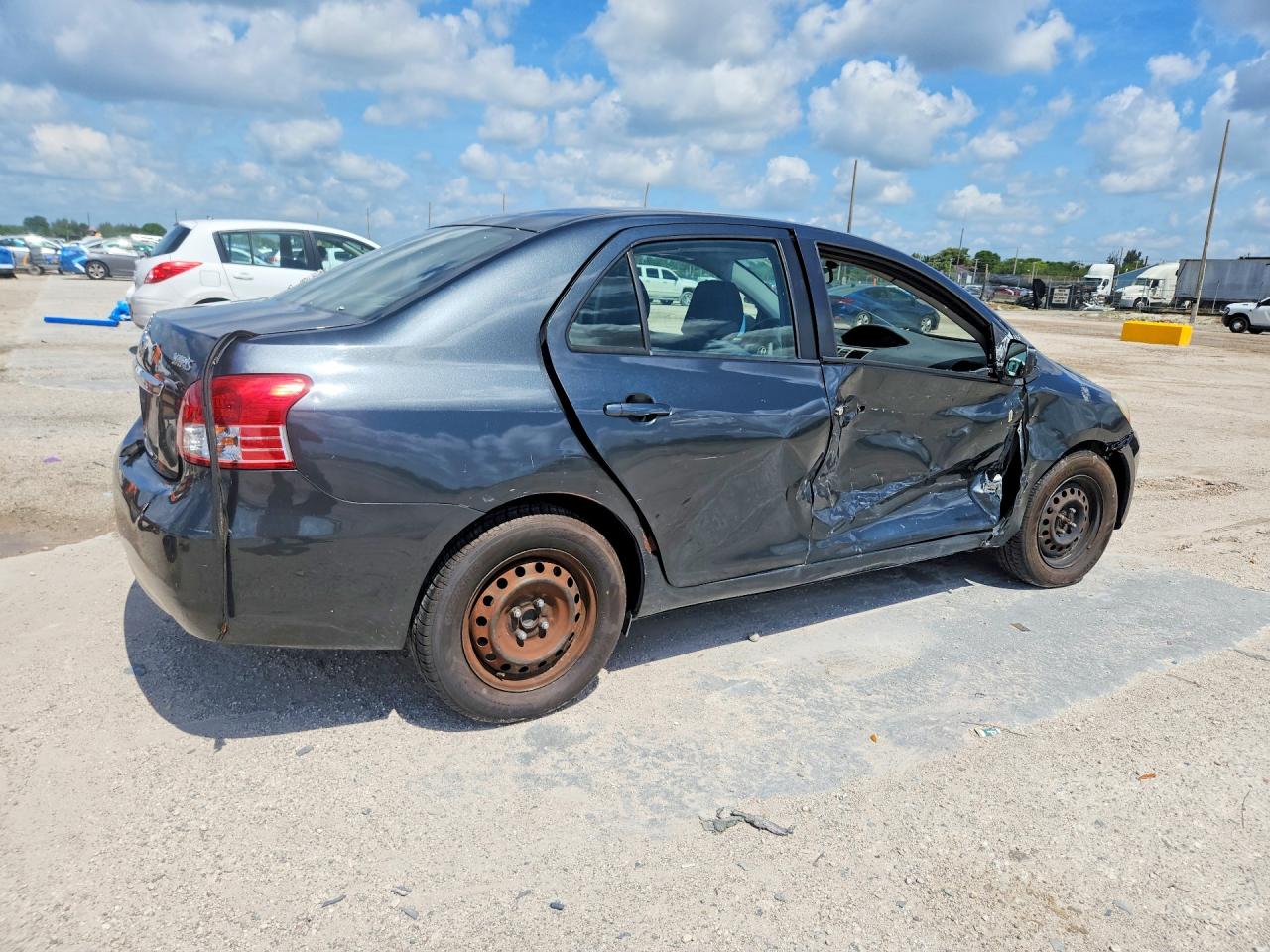 2011 Toyota Yaris Base Black vin: JTDBT4K34BL002107