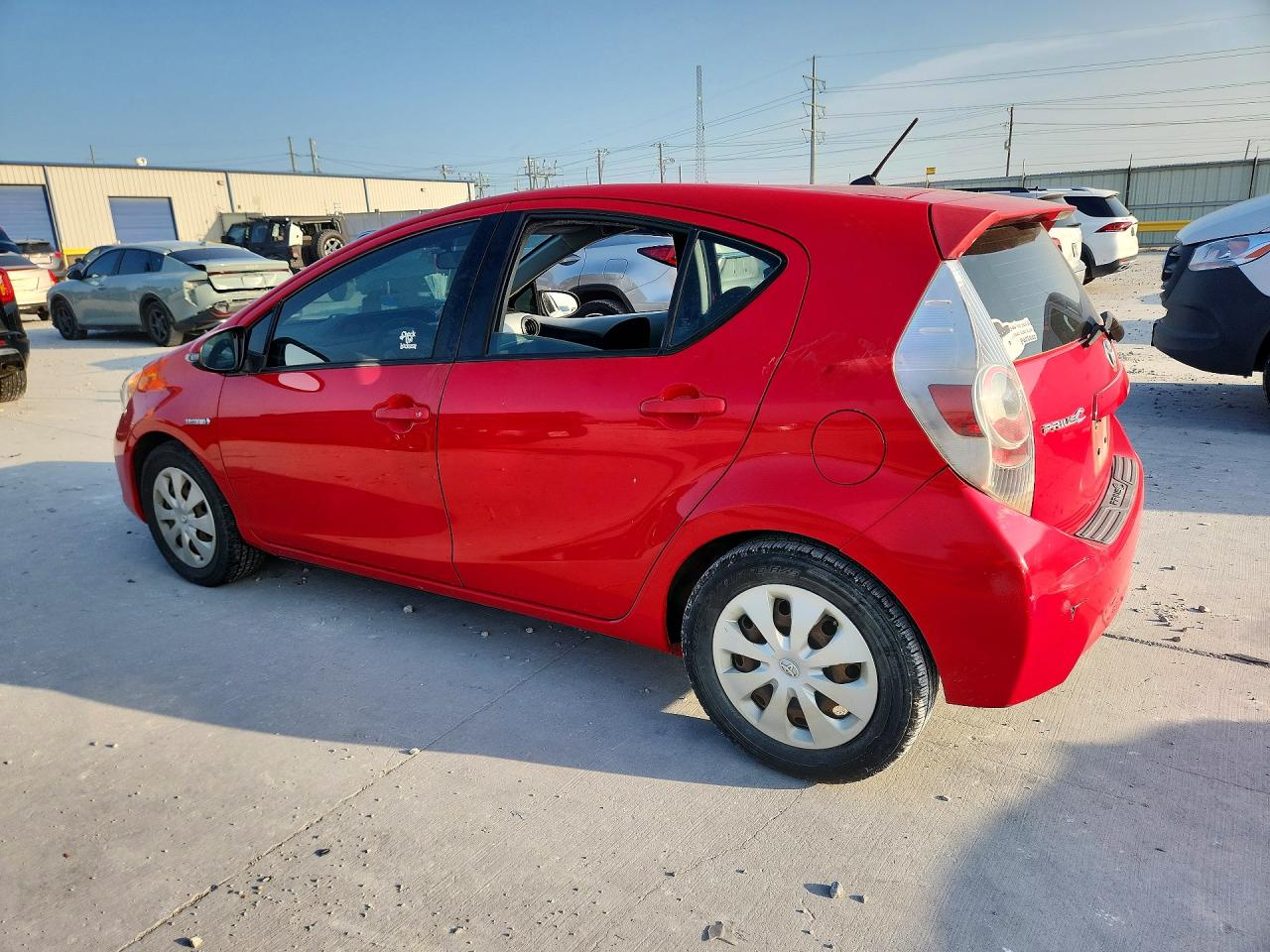 2012 Toyota Prius C Two Red vin: JTDKDTB31C1503220