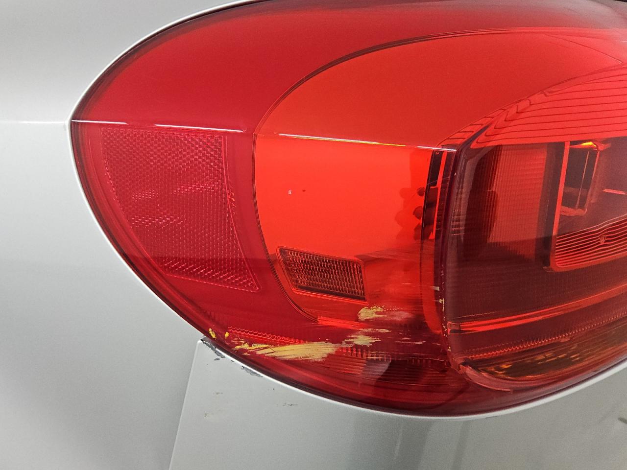 2014 Volkswagen Tiguan S Silver vin: WVGAV3AX9EW603354 Damage: Left Tail Light, Heavy Scratch, Replacement Required