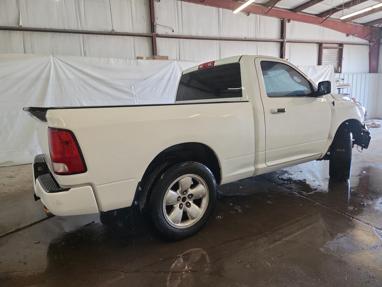 2013 Ram 1500 St White vin: 3C6JR6AT5DG583681 Damage: Rear Metal Bumper Painted, Heavy Scratch, 2 To 3 Inches