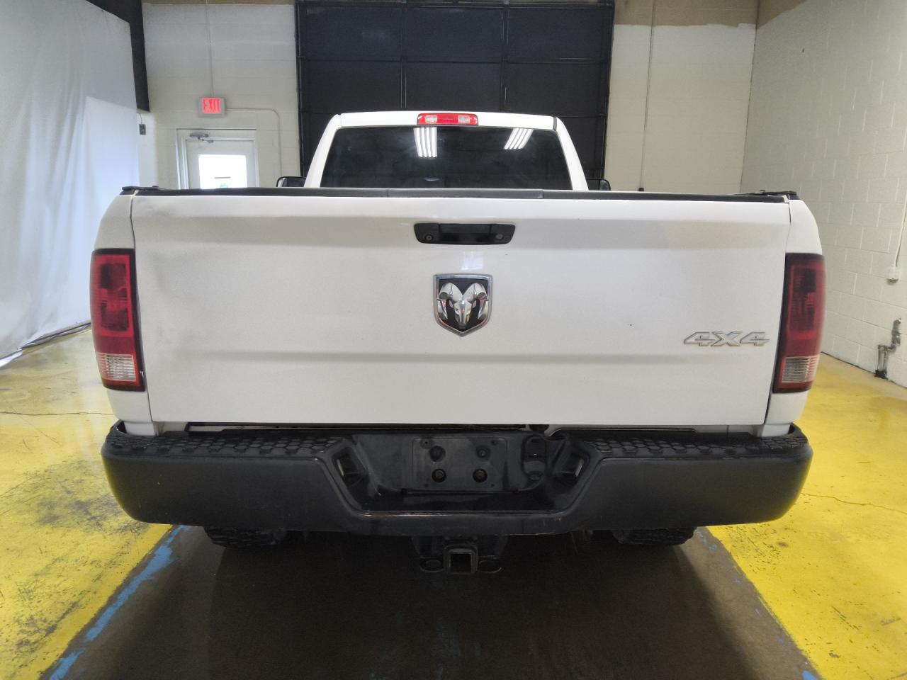 2014 Ram 2500 St White vin: 3C6LR5AT3EG319122 Damage: Rear Metal Bumper Painted, Heavy Scratch, 9 To 10 Inches