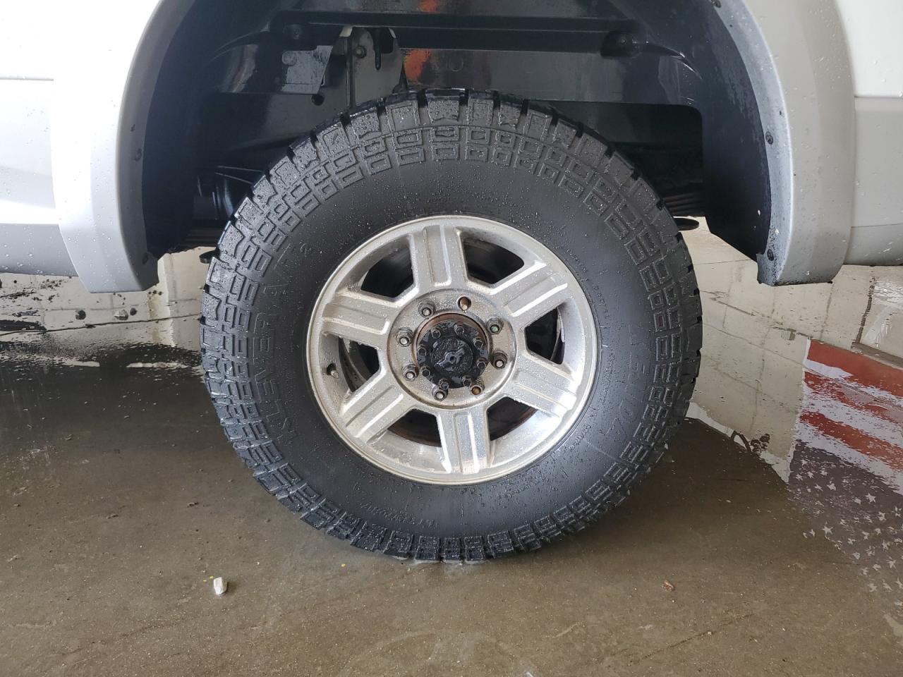 2012 Dodge Ram 2500 Laramie White vin: 3C6UD5NL4CG199518 Damage: Left Rear Center Cap, Missing, Replacement Required