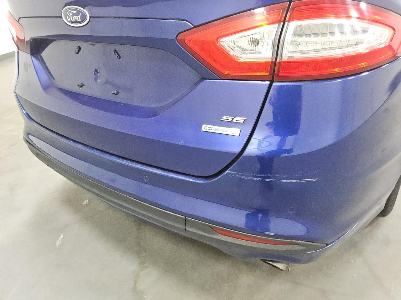 2014 Ford Fusion Se Blue vin: 3FA6P0HD5ER217117 Damage: Rear Bumper, Dent(S) W/ Paint Dmg, 1 To 2 Inches