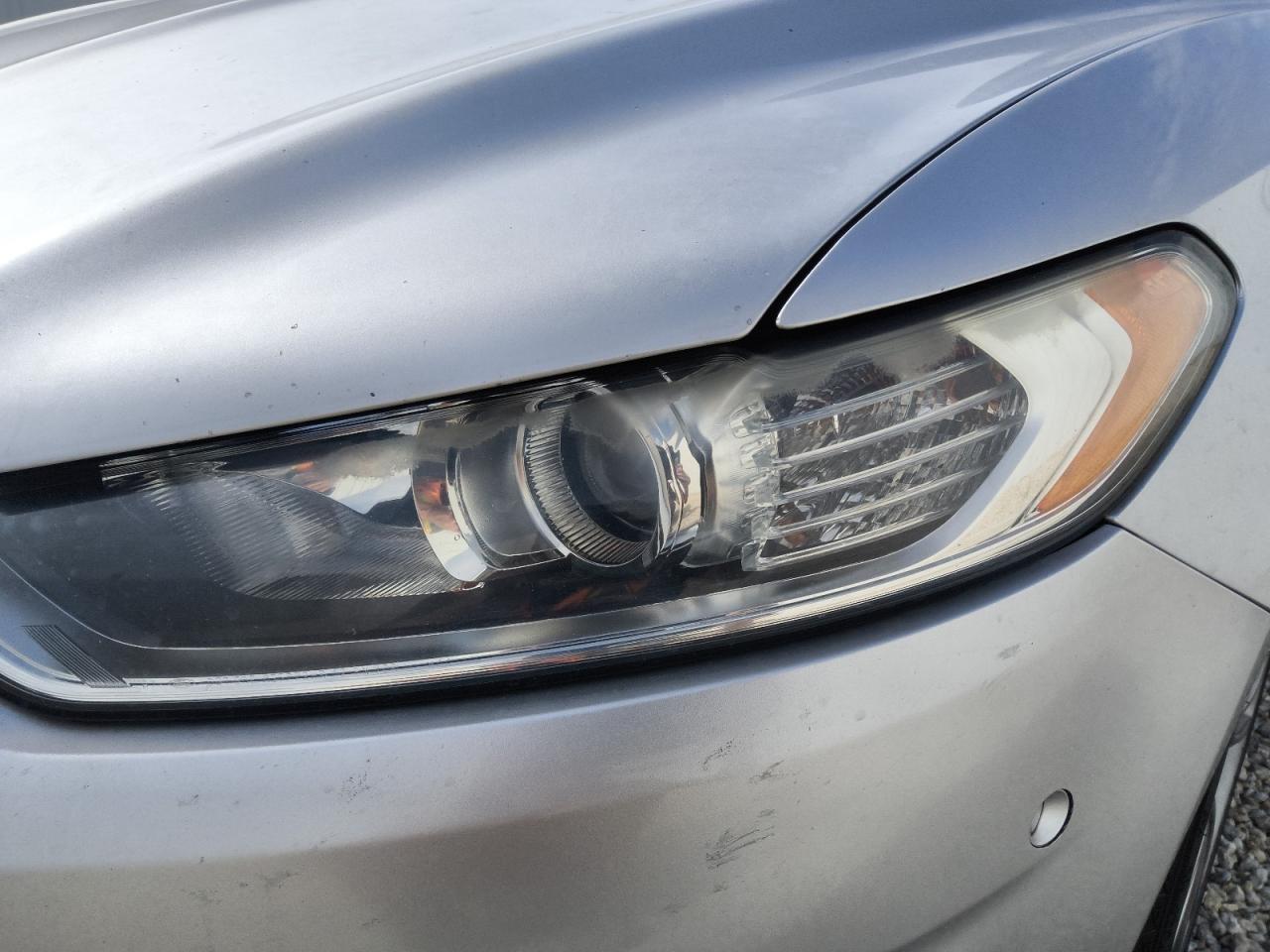 2013 Ford Fusion Titanium Серебряный vin: 3FA6P0K92DR138345 Damage: Left Head Lamp, Faded, Repair Required