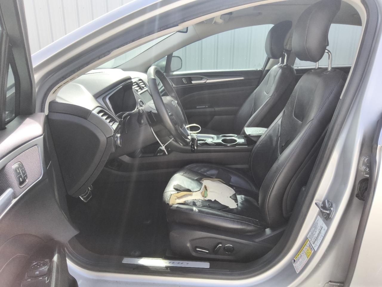 2013 Ford Fusion Titanium Серебряный vin: 3FA6P0K92DR138345 Damage: Left Front Seat, Torn, > 12 Inches