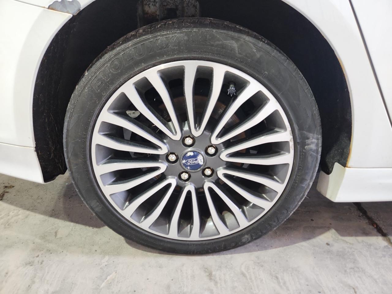 2017 Ford Fusion Titanium White vin: 3FA6P0K93HR131409 Damage: Right Rear Wheel, Curb Rash, 1 To 2 Inches