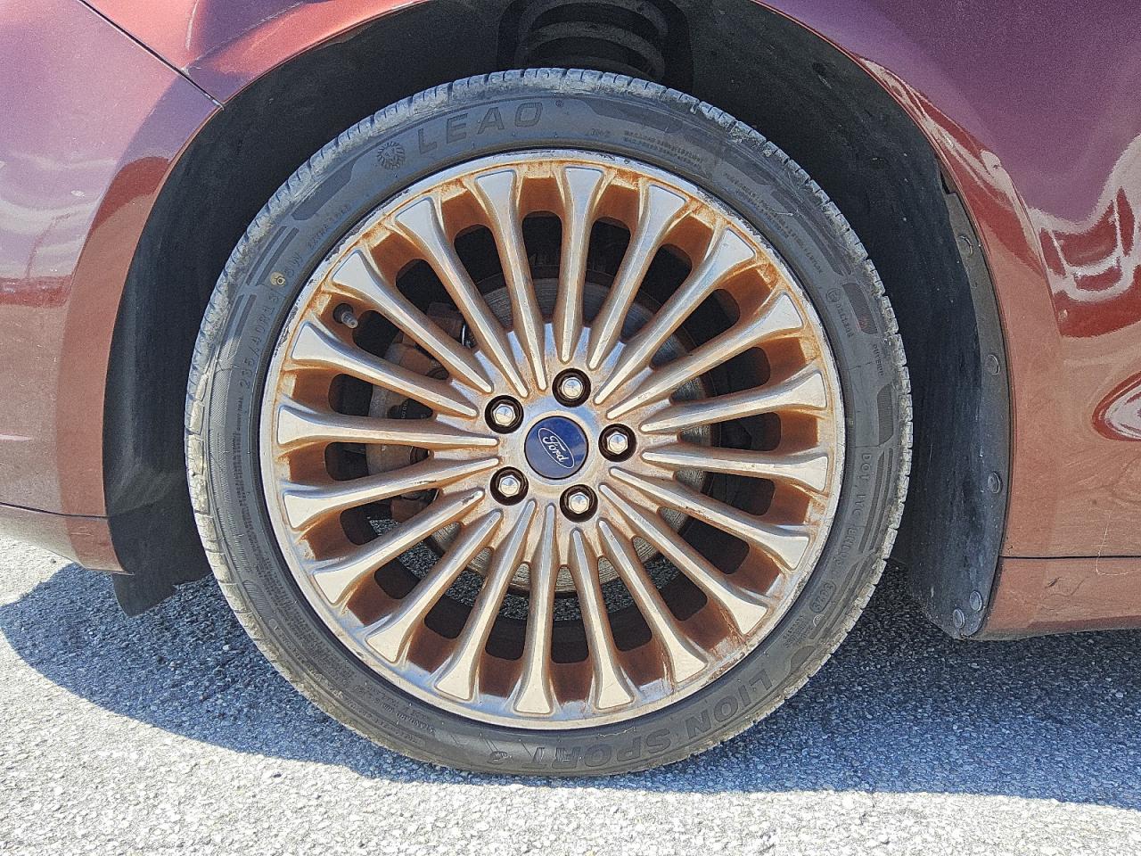 2015 Ford Fusion Titanium Brown vin: 3FA6P0K97FR269466 Damage: Left Front Wheel, Curb Rash, > 12 Inches