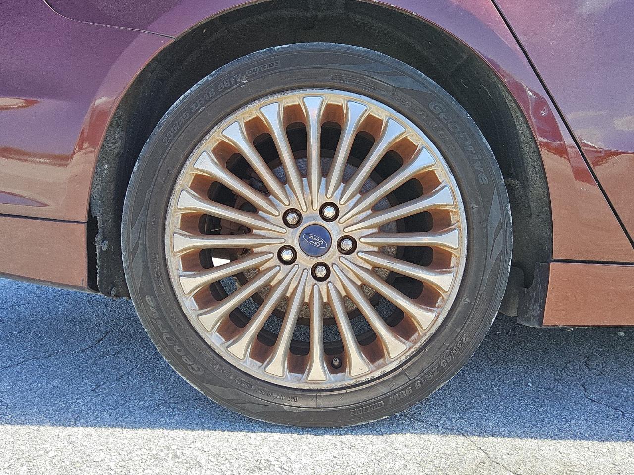 2015 Ford Fusion Titanium Brown vin: 3FA6P0K97FR269466 Damage: Right Rear Wheel, Curb Rash, > 12 Inches