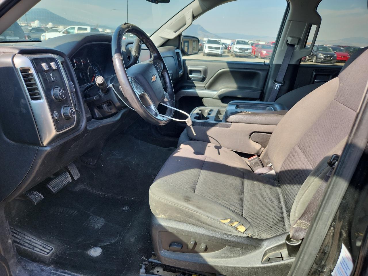 2015 Chevrolet Silverado K1500 Lt Black vin: 3GCUKREC0FG538205 Damage: Left Front Seat Cushion, Cut, 4 To 5 Inches