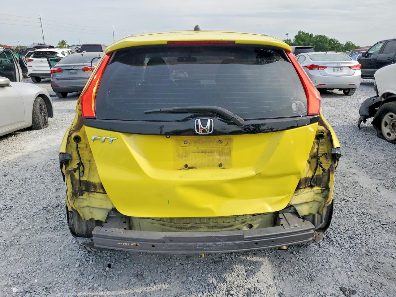 2015 Honda Fit Lx Yellow vin: 3HGGK5G50FM771332
