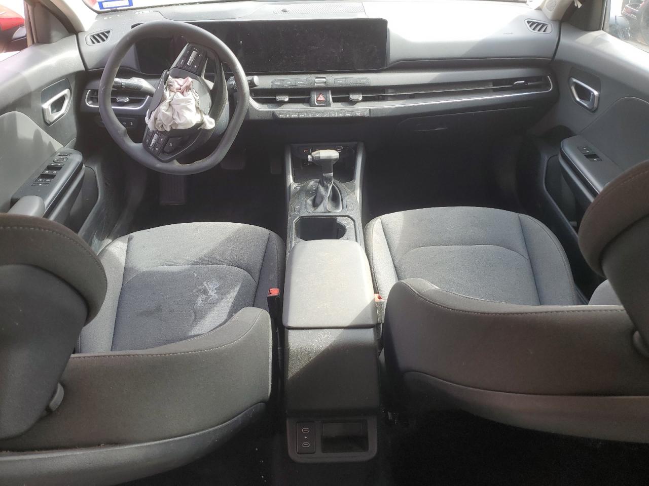2025 Kia K4 Lxs Red vin: 3KPFT4DE5SE039983 Damage: Left Front Seat, Stained, Permanent
