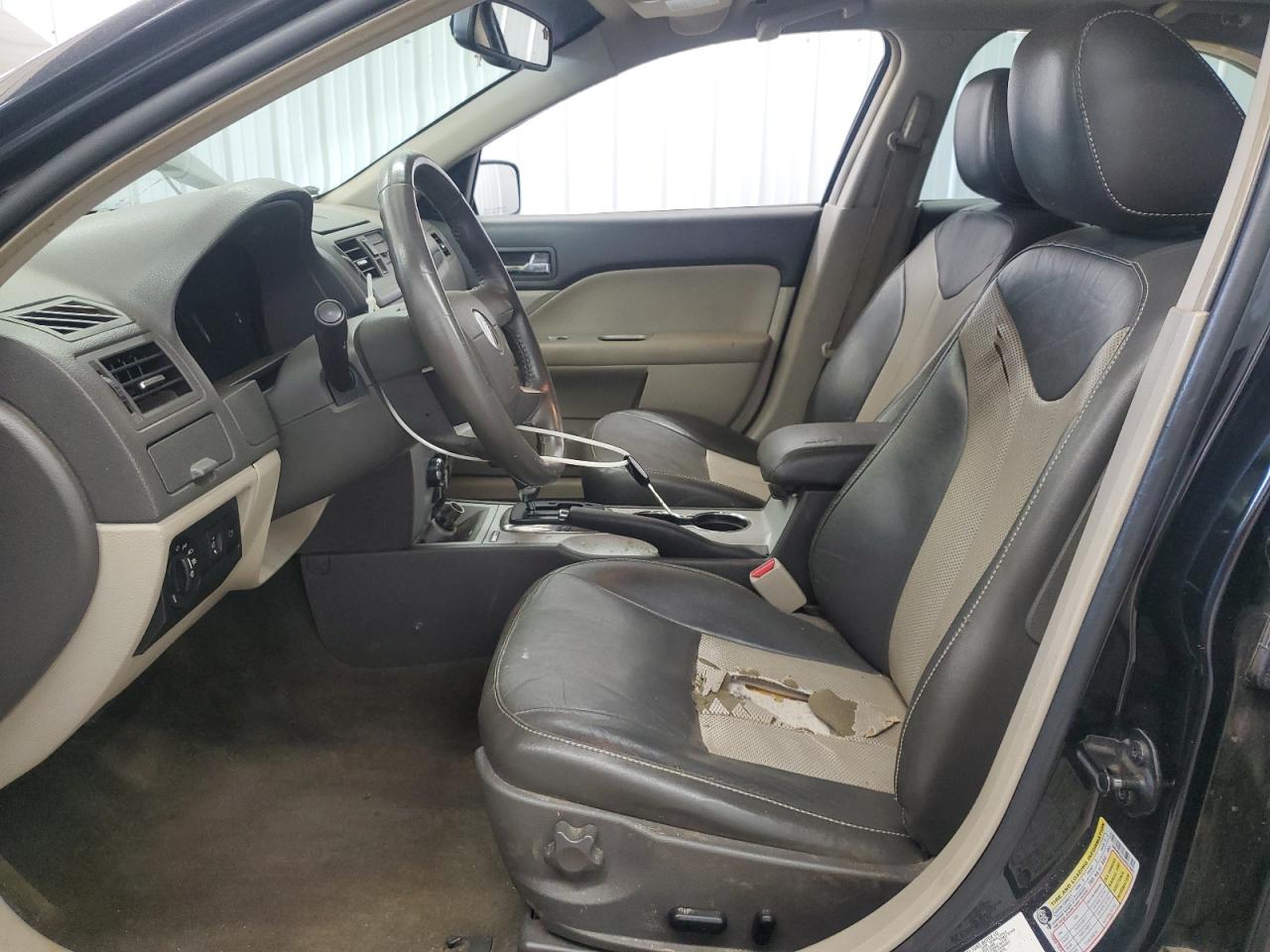 2010 Mercury Milan Premier Black vin: 3MEHM0JGXAR623967 Damage: Left Front Seat, Torn, > 12 Inches