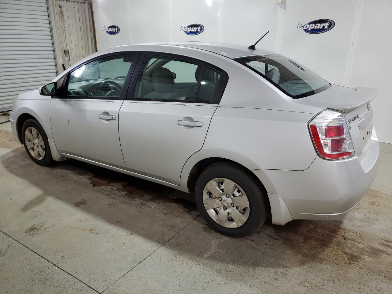 2012 Nissan Sentra 2.0 Silver vin: 3N1AB6AP9CL659735 Damage: Left Qtr Panel, Dent(S) W/ Paint Dmg, 1/2 To 1 Inch