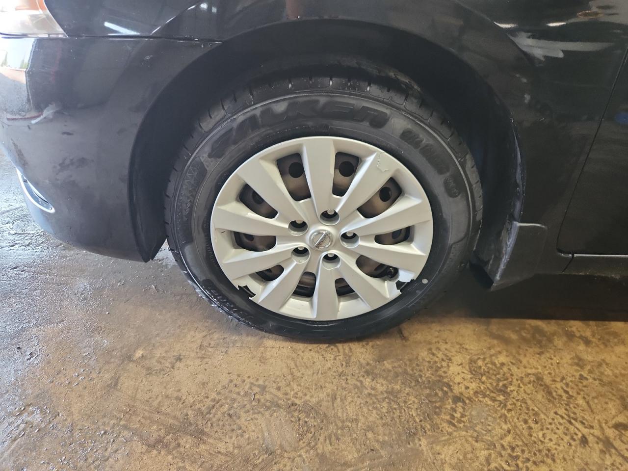 2015 Nissan Sentra S Black vin: 3N1AB7AP0FY341290 Damage: Left Front Wheel Cover, Broken, Replacement Required