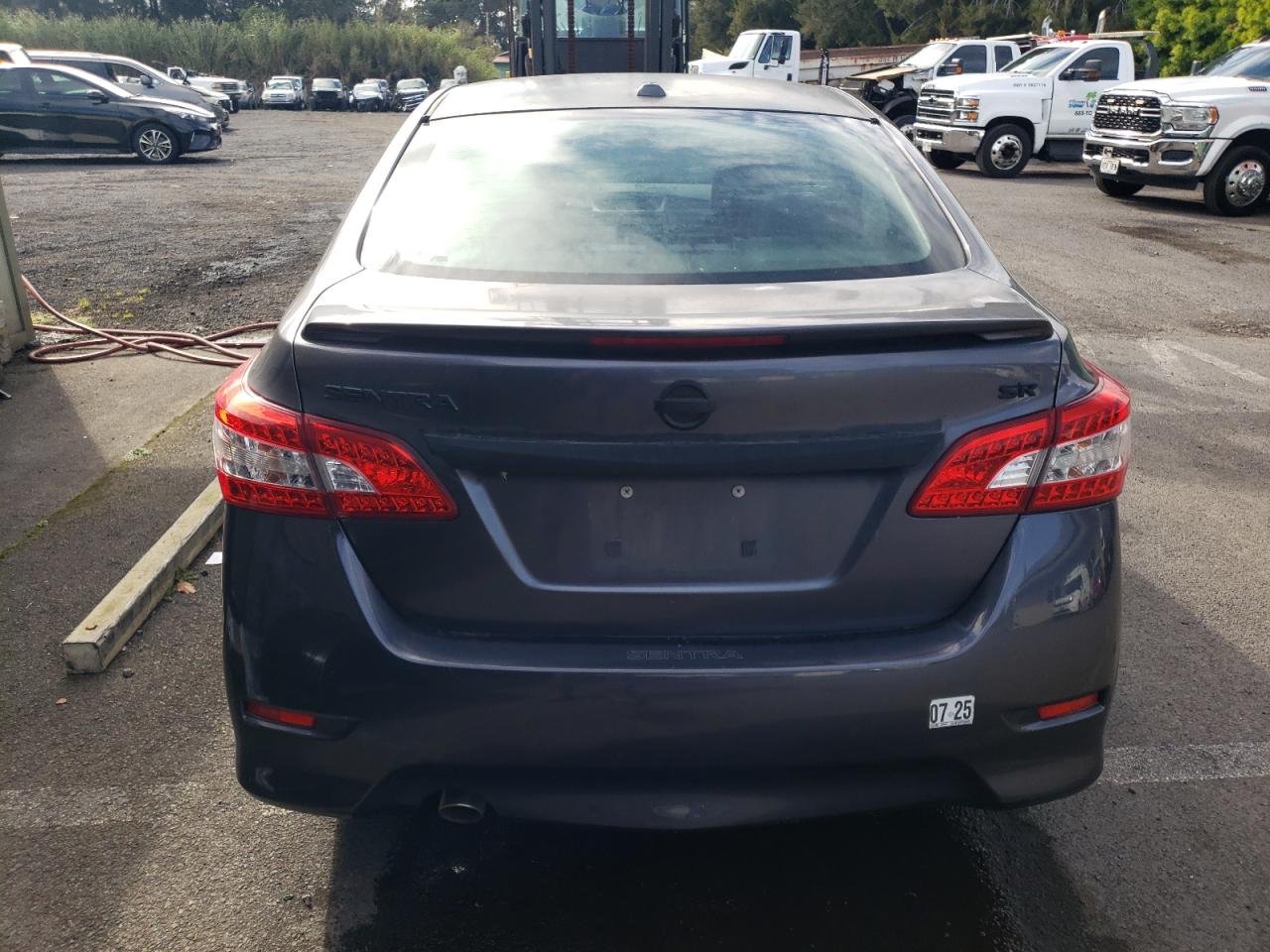 2015 Niss Sentra S Charcoal vin: 3N1AB7APXFY364382 Damage: Rear Bumper, De-Identify, Removal Required