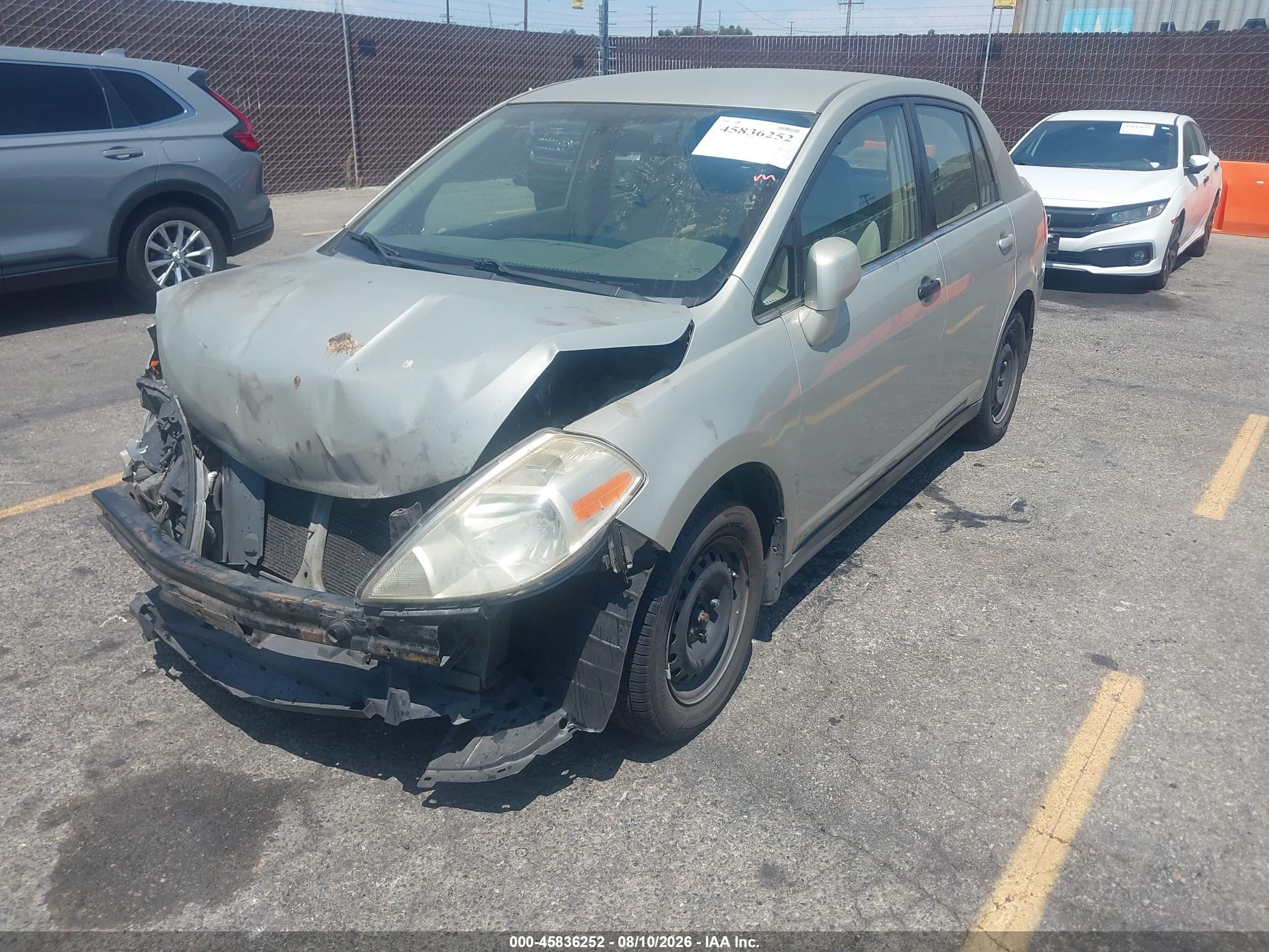 2007 Nissan Versa 1.8s Tan vin: 3N1BC11E07L459061