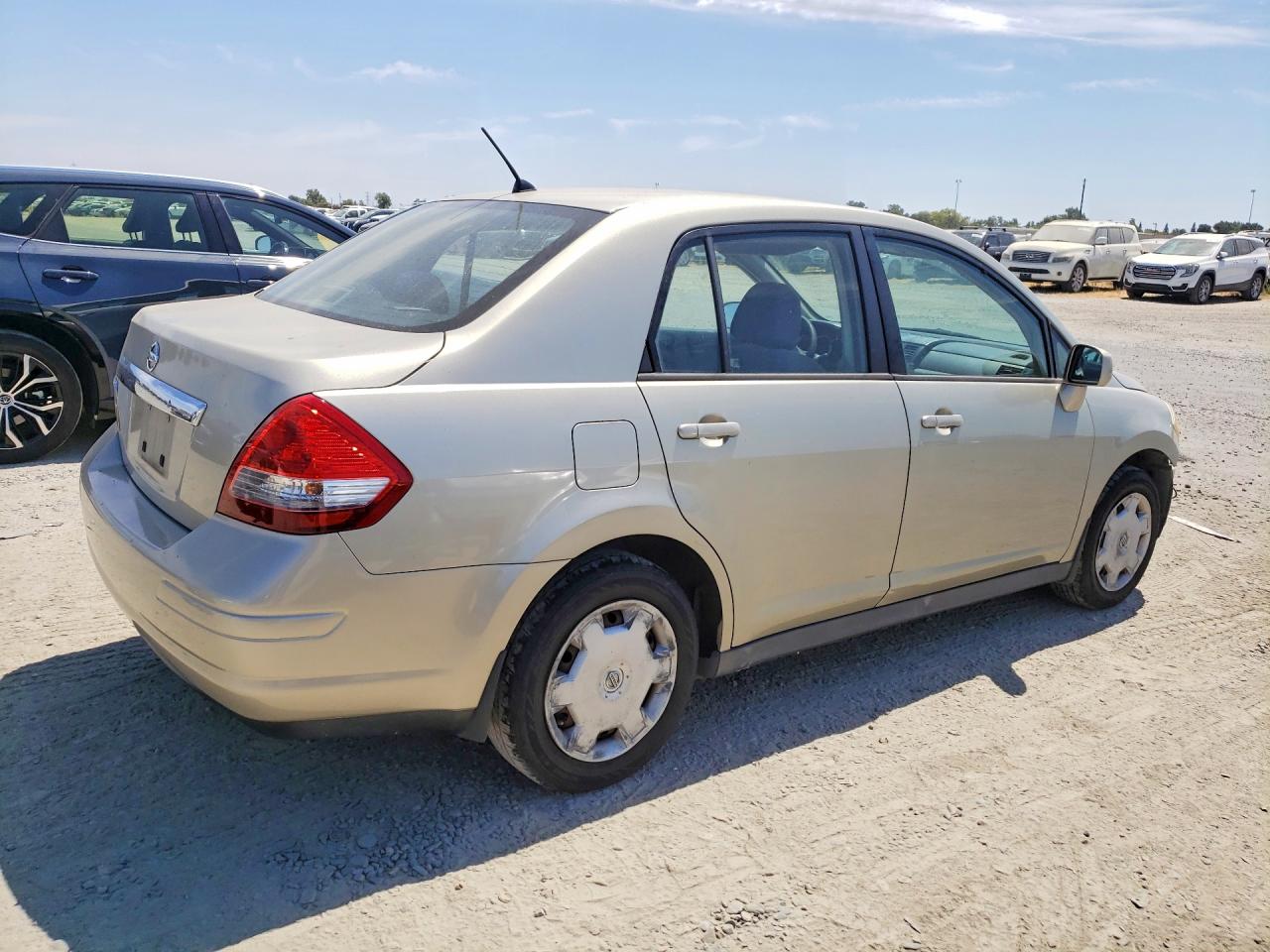 2009 Nissan Versa 1.8 S Cream vin: 3N1BC11E39L424534
