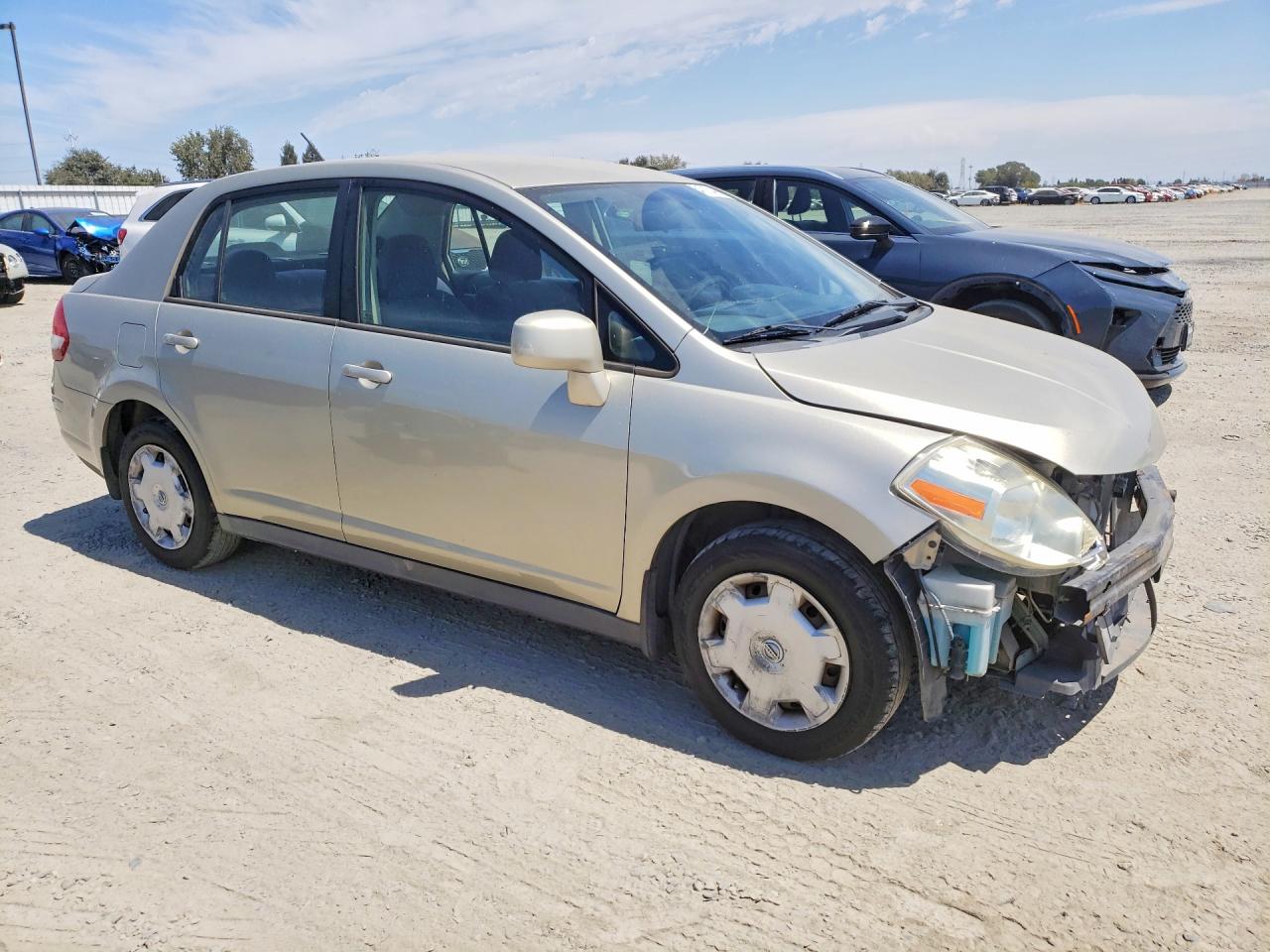 2009 Nissan Versa 1.8 S Cream vin: 3N1BC11E39L424534