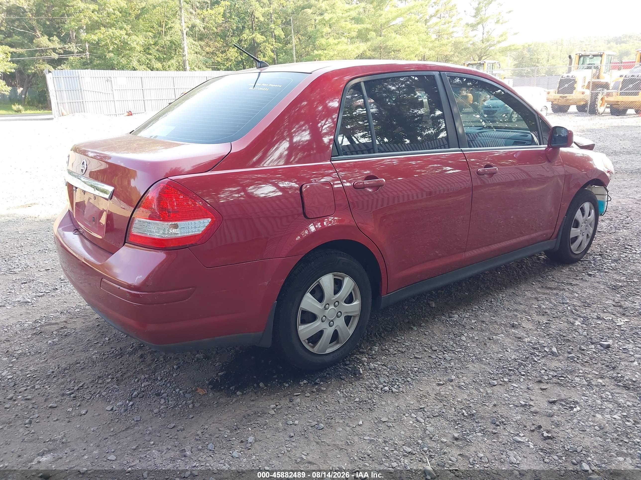 2009 Nissan Versa 1.8s Red vin: 3N1BC11E69L443398