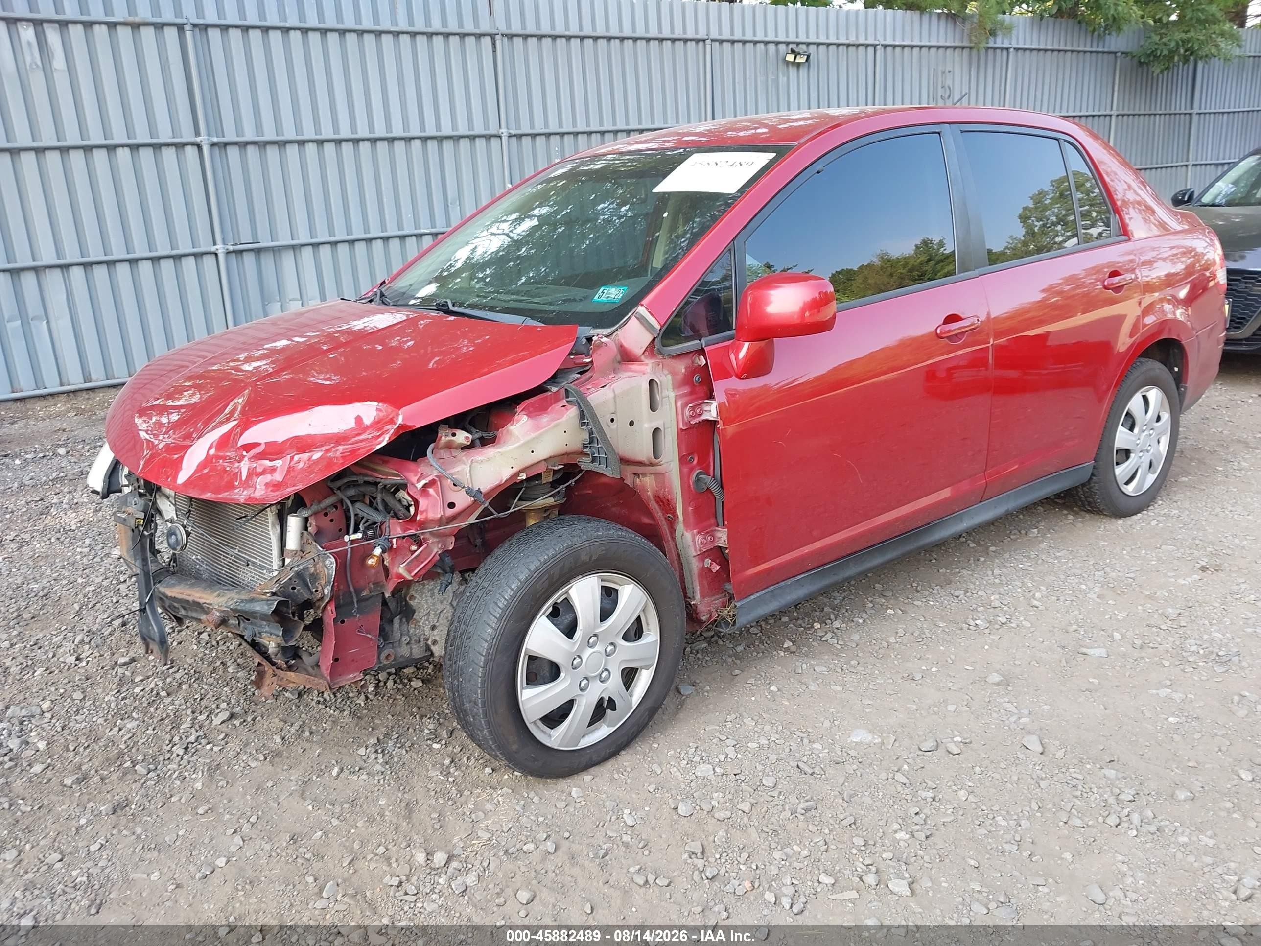 2009 Nissan Versa 1.8s Red vin: 3N1BC11E69L443398