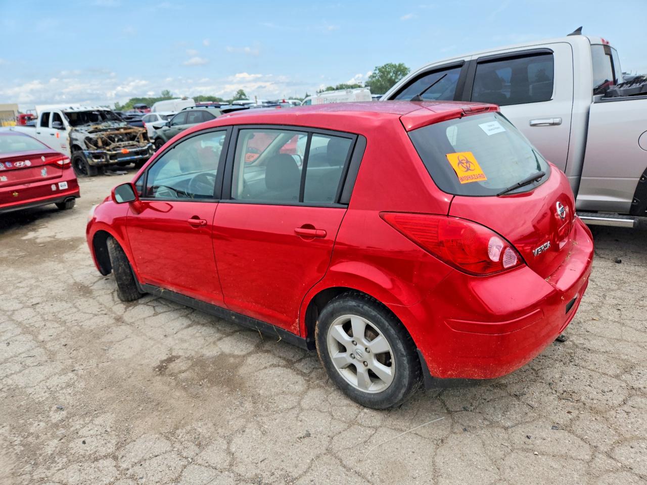2009 Nissan Versa 1.8 S Red vin: 3N1BC13E29L407950