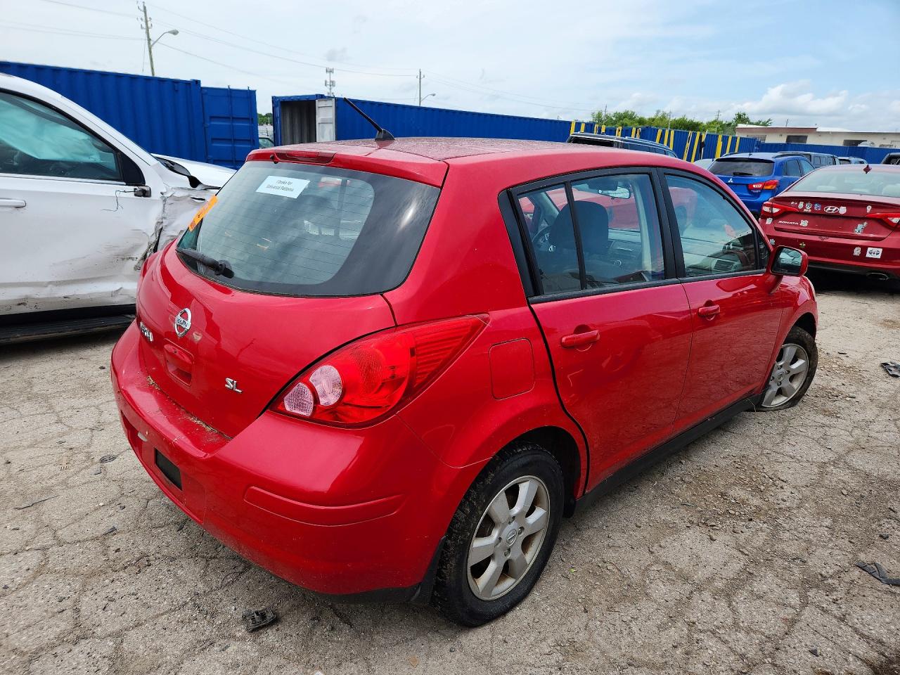 2009 Nissan Versa 1.8 S Red vin: 3N1BC13E29L407950