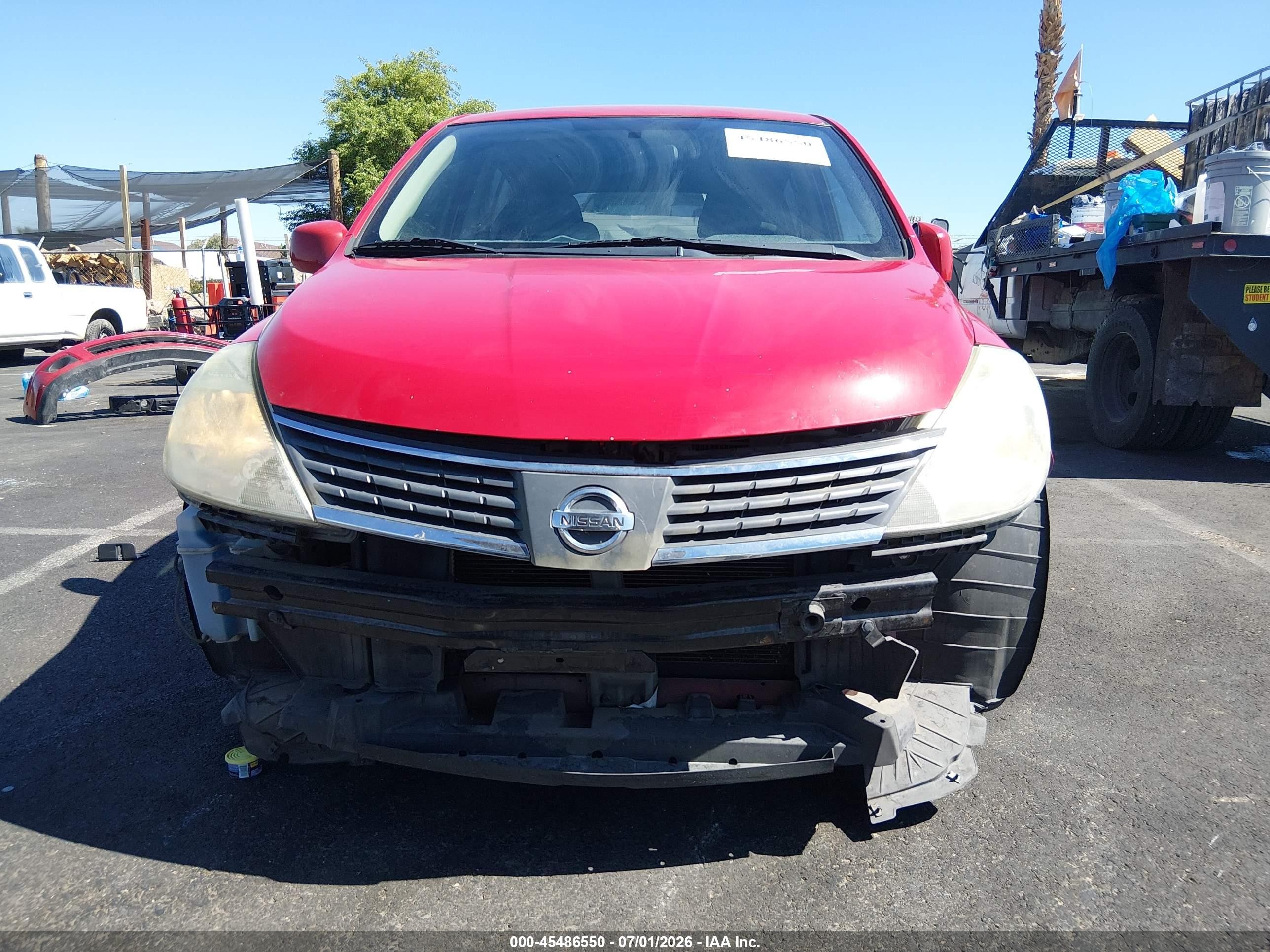 2009 Nissan Versa 1.8s Red vin: 3N1BC13E49L384056