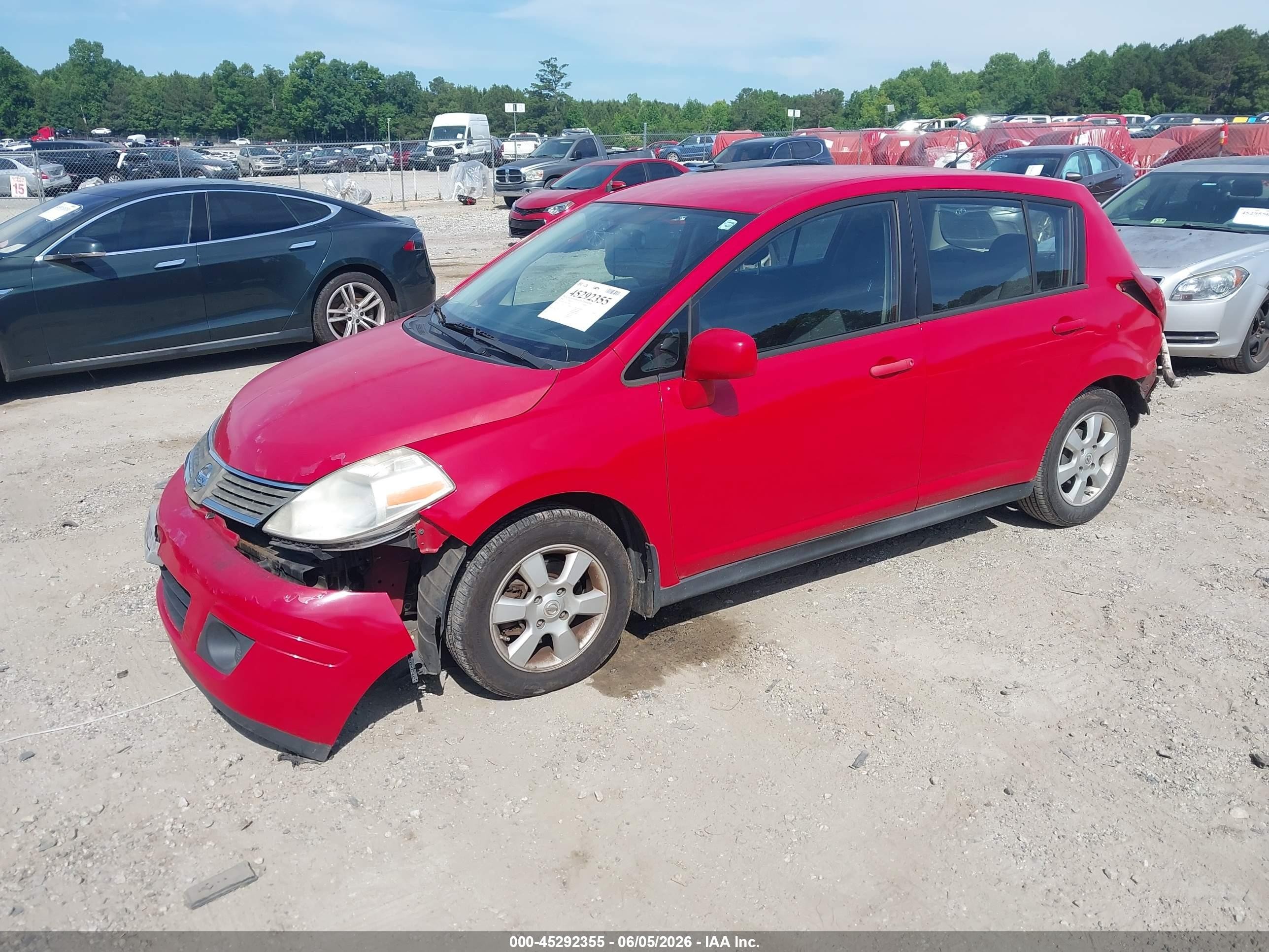2009 Nissan Versa 1.8s Red vin: 3N1BC13E49L412969