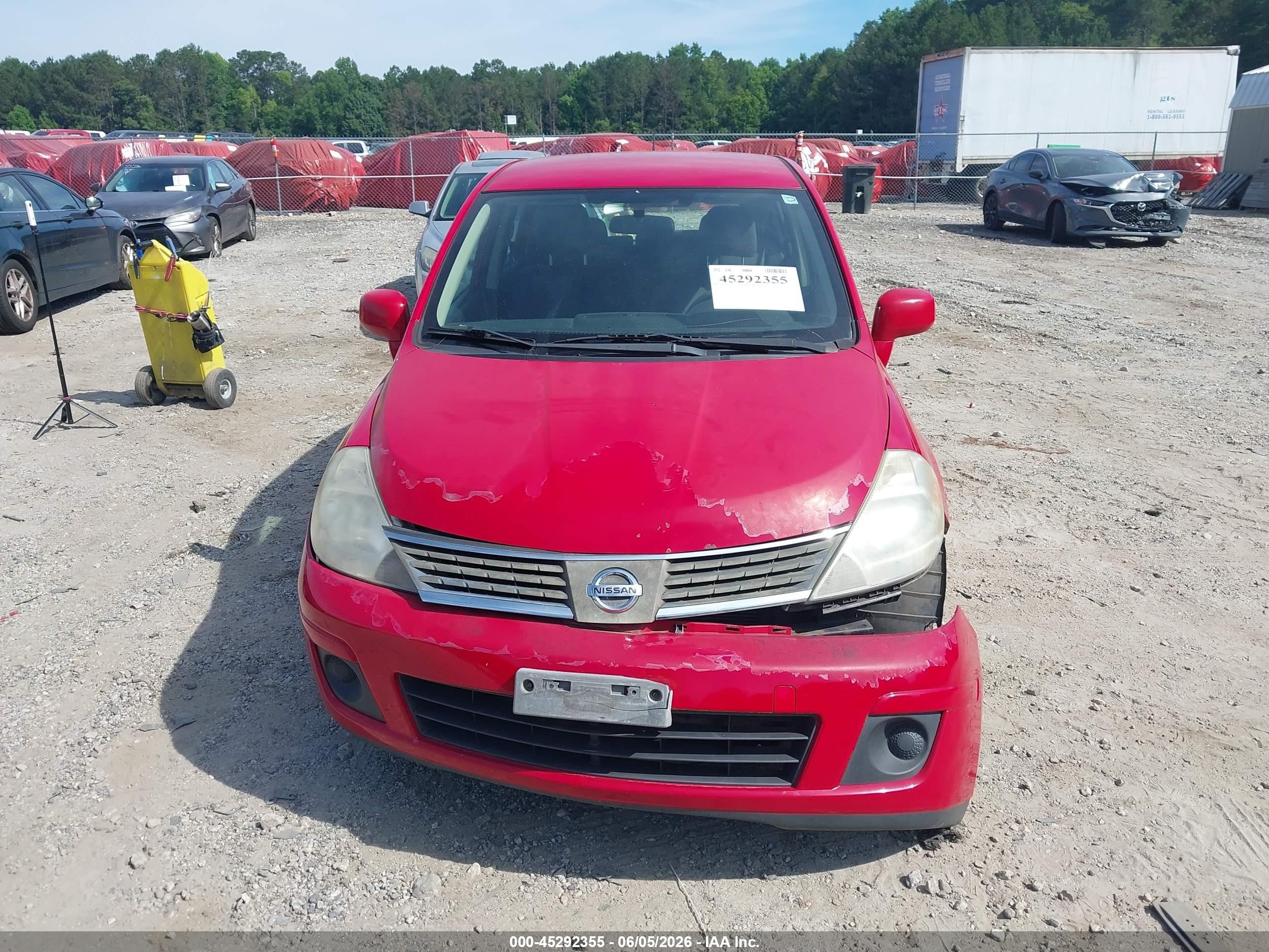 2009 Nissan Versa 1.8s Red vin: 3N1BC13E49L412969