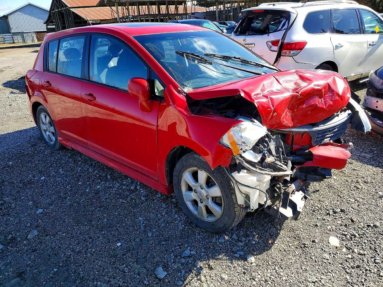 2009 Nissan Versa 1.8 S Red vin: 3N1BC13E69L394653