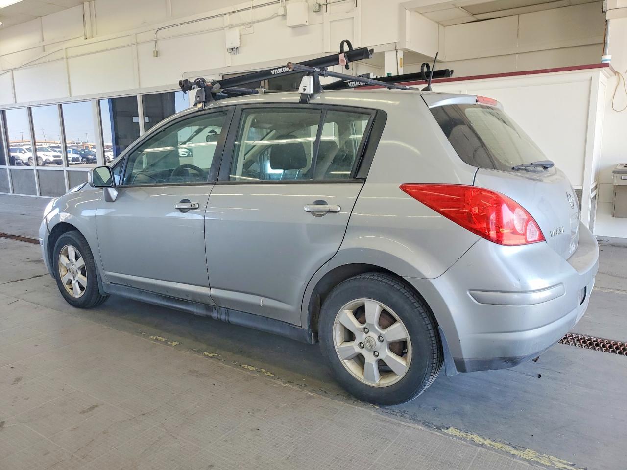 2009 Niss Versa Sl 4d Hatchbac Silver vin: 3N1BC13EX9L403726