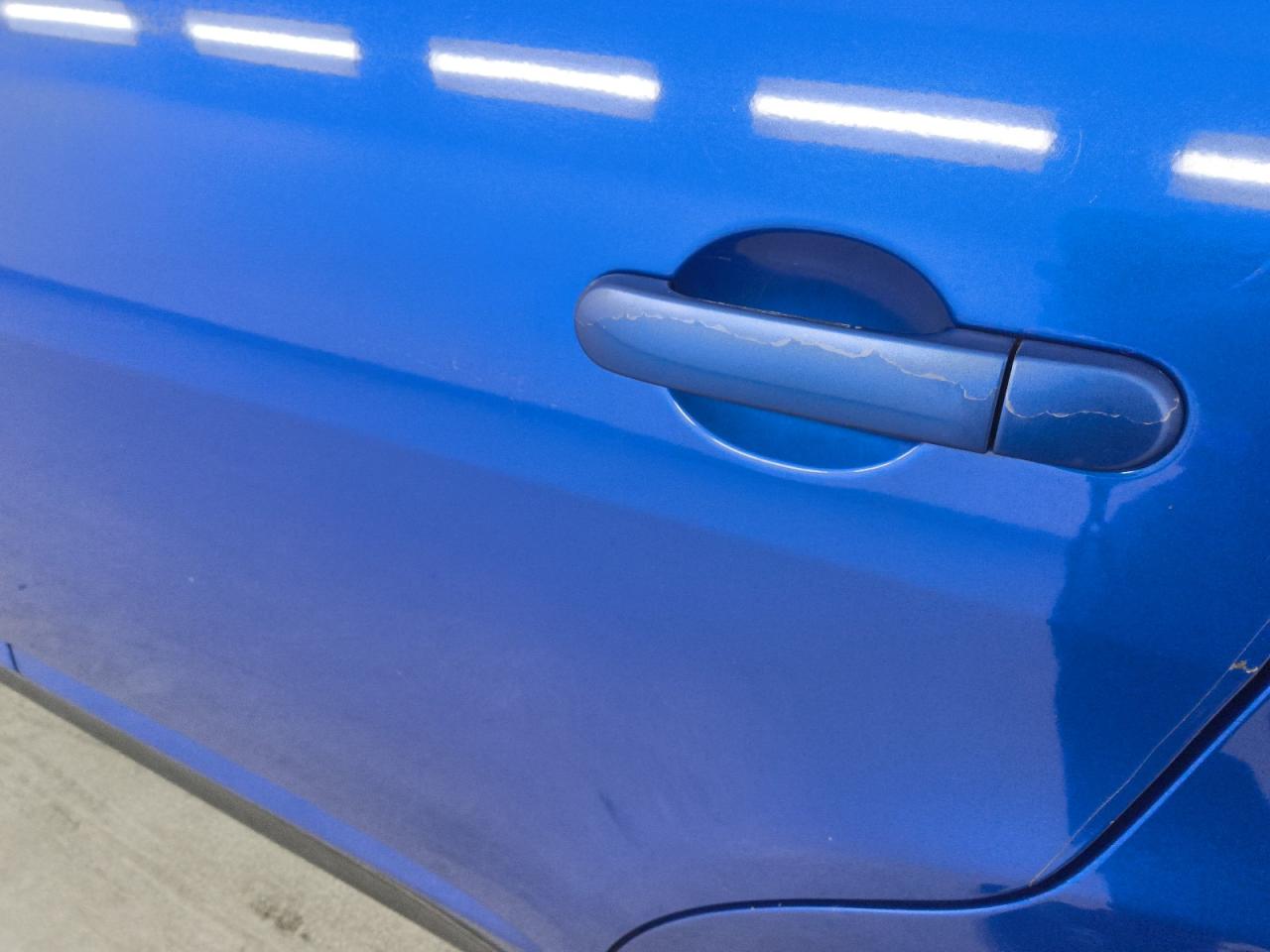 2012 Nissan Versa Blue vin: 3N1BC1CP0CK261174 Damage: Left Rear Door Handle, Peeling, 3 To 4 Inches