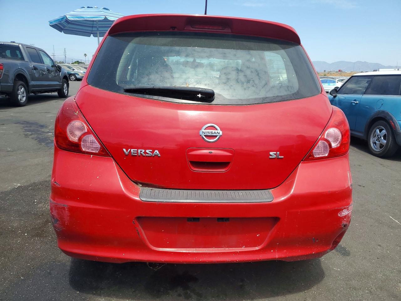 2012 Nissan Versa 1.8 S Red vin: 3N1BC1CP1CK206992