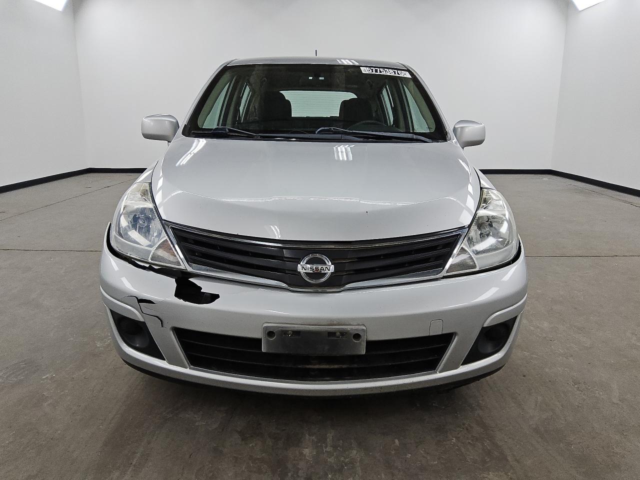 2011 Nissan Versa Silver vin: 3N1BC1CP2BL399839 Damage: Left Head Lamp, Faded, Repair Required