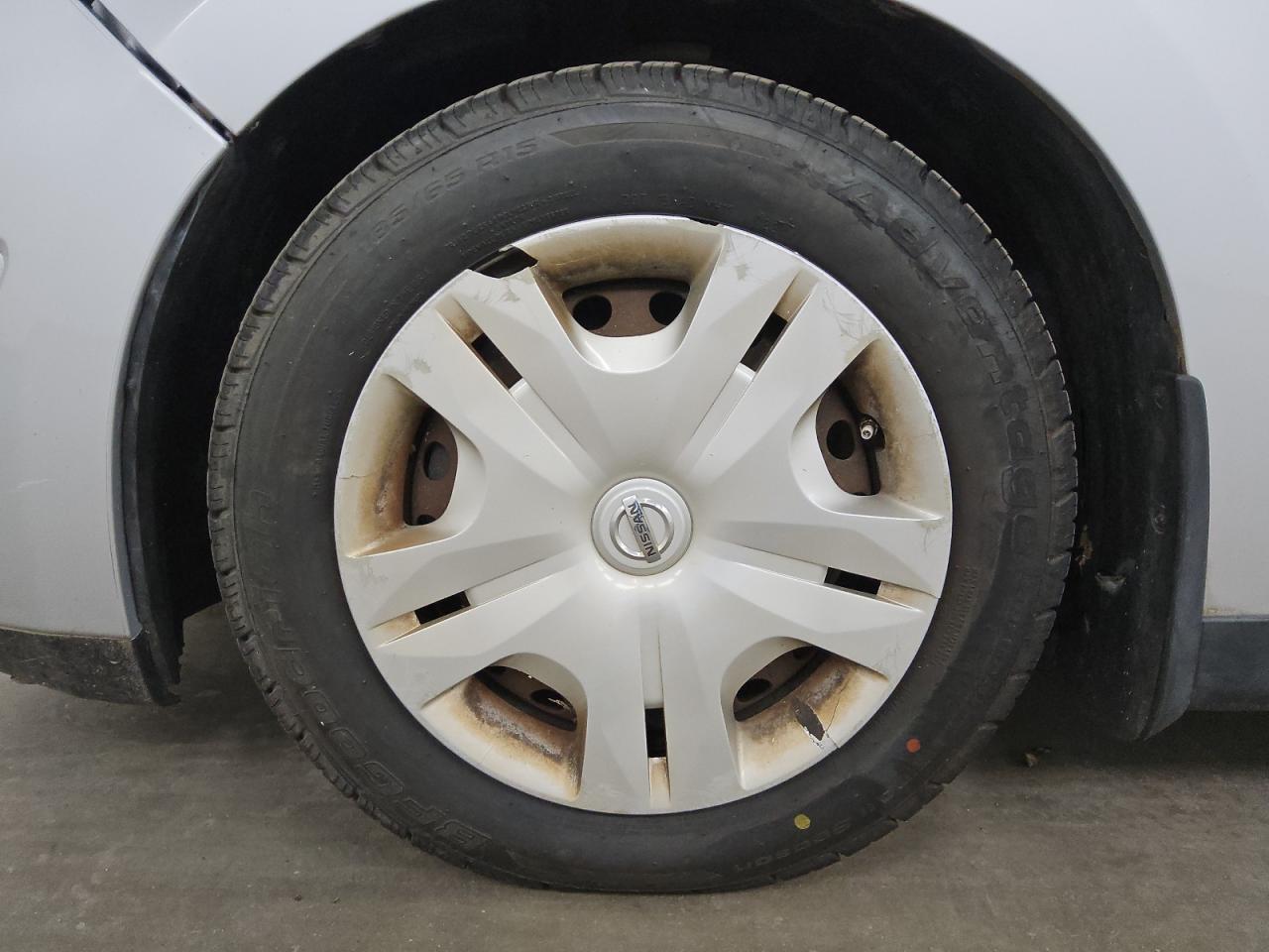 2011 Nissan Versa Silver vin: 3N1BC1CP2BL399839 Damage: Left Front Wheel Cover, Broken, Replacement Required