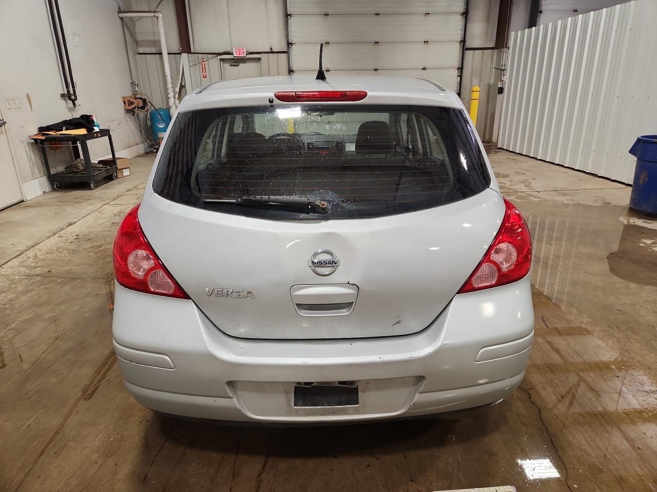 2012 Nissan Versa 1.8 S Silver vin: 3N1BC1CP6CK277301 Damage: Lift Gate, Dent(S) W/No Paint Dmg, 6 To 7 Inches