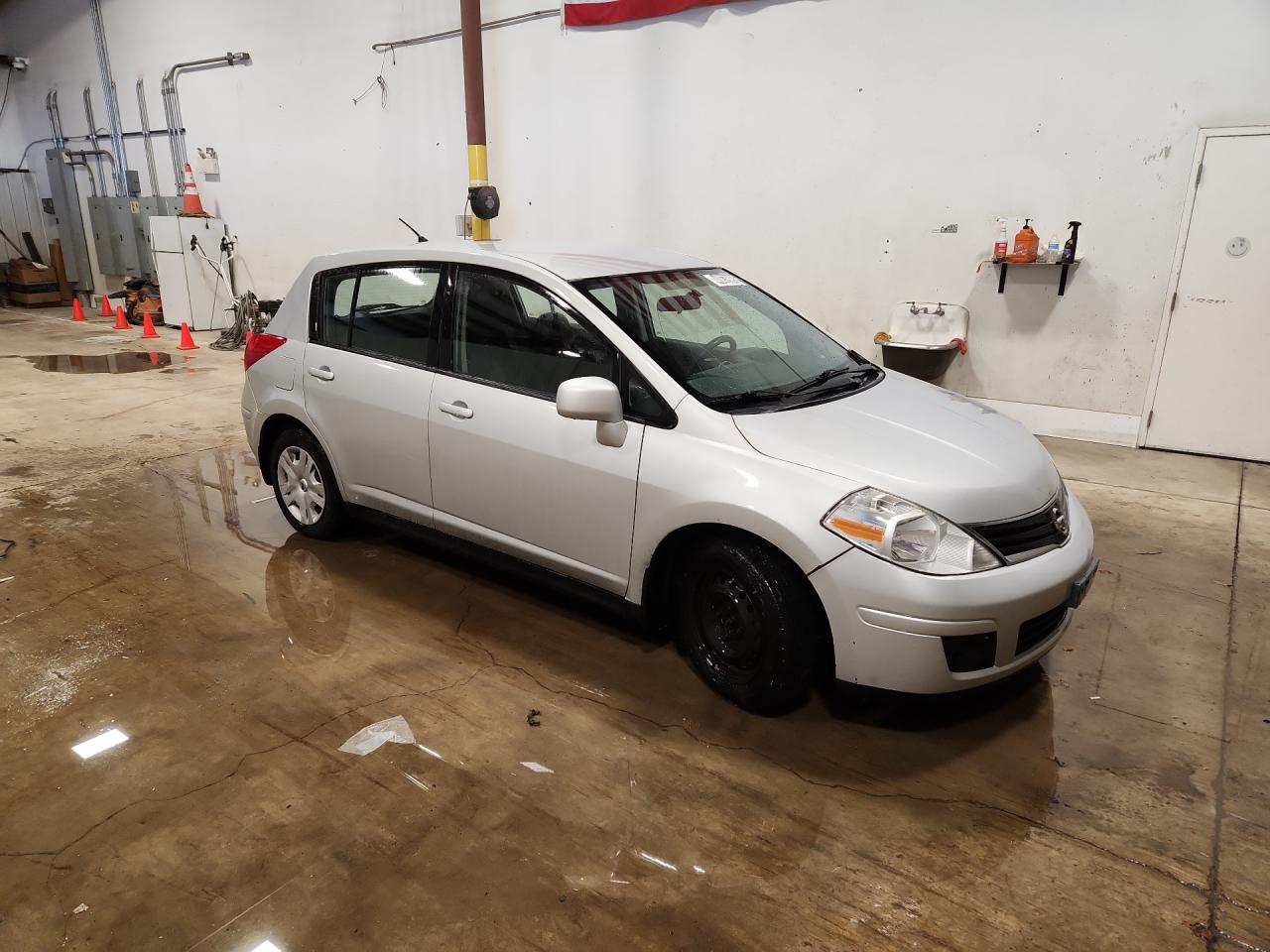 2012 Nissan Versa 1.8 S Silver vin: 3N1BC1CP6CK277301 Damage: Right Front Wheel Cover, Missing, Replacement Required